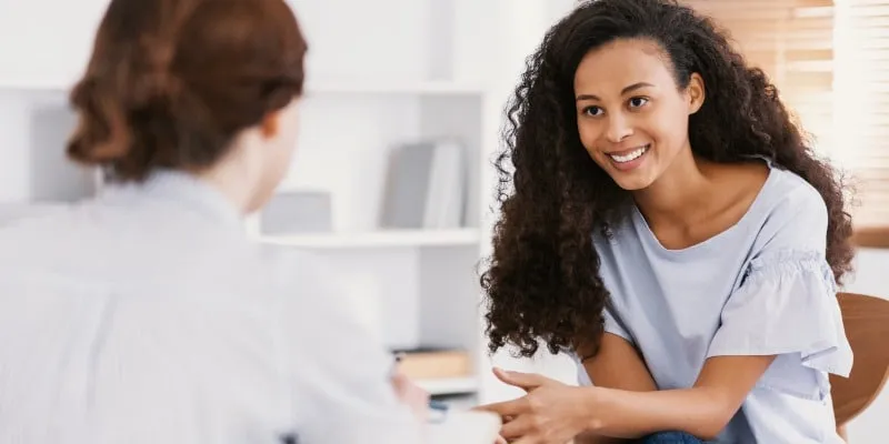 Person speaking to Community Support Worker - 10 FAQS About Community Support Workers in Alberta